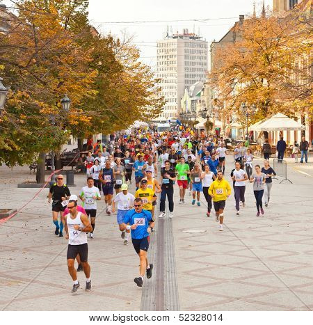 NOVI SAD, SERBIA - OCTOBER 13: Unidentified runners on the street during Novi Sad autumn Marathon on October 13, 2013 in Novi Sad, Serbia