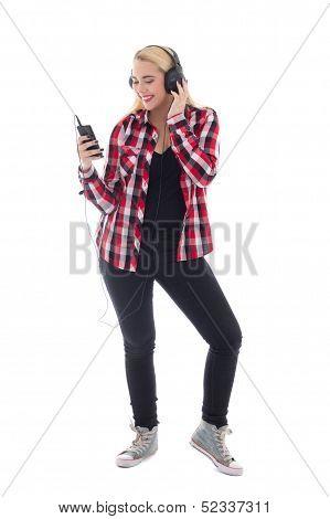 Attractive Teenage Girl Listening Music In Headhones Isolated On White