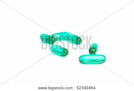 Green Pills On White