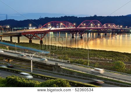 Urban day to night, famous Guandu Bridge in Taipei, Taiwan, Asia. Photo manipulation.