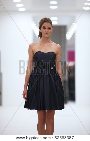 ZAGREB, CROATIA - OCTOBER 12: Fashion model in cocktail dress made by Lorien on 'Wedding Expo' show in the Westgate Shopping City in Zagreb, Croatia on October 12, 2013