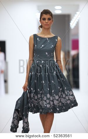 ZAGREB, CROATIA - OCTOBER 12: Fashion model in cocktail dress made by Lorien on 'Wedding Expo' show in the Westgate Shopping City in Zagreb, Croatia on October 12, 2013