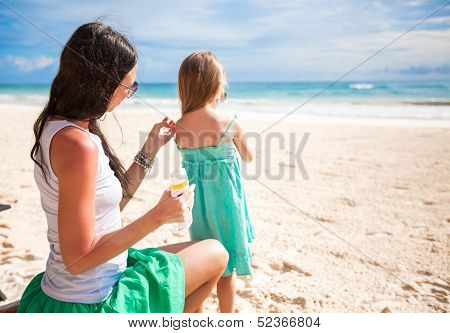 Mother Protects Her Baby From The Sun With Suncream