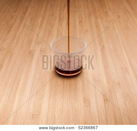 liquid is poured into a measuring cup