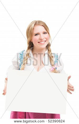 Bavarian woman in dirndl, holding blank signboard.