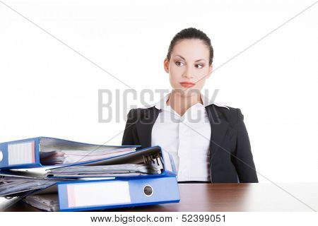 Sad woman with ringbinders sitting at the desk. Tired and exhousted business woman. 