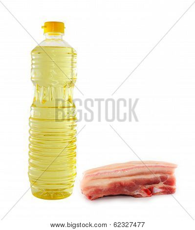 Vegetable Oil In A Plastic Bottler And Raw Pork
