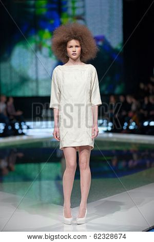 ZAGREB, CROATIA - MARCH 28, 2014: Fashion model wearing clothes designed by Marina Design and Marija Ivanovic jewelry on the 'Fashion.hr' fashion show