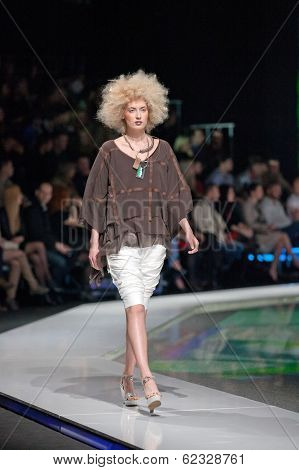 ZAGREB, CROATIA - MARCH 28, 2014: Fashion model wearing clothes designed by Marina Design and Marija Ivanovic jewelry on the 'Fashion.hr' fashion show