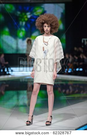 ZAGREB, CROATIA - MARCH 28, 2014: Fashion model wearing clothes designed by Marina Design and Marija Ivanovic jewelry on the 'Fashion.hr' fashion show
