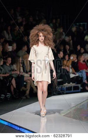 ZAGREB, CROATIA - MARCH 28, 2014: Fashion model wearing clothes designed by Marina Design and Marija Ivanovic jewelry on the 'Fashion.hr' fashion show