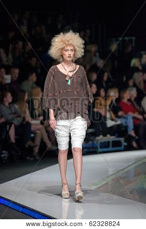 ZAGREB, CROATIA - MARCH 28, 2014: Fashion model wearing clothes designed by Marina Design and Marija Ivanovic jewelry on the 'Fashion.hr' fashion show