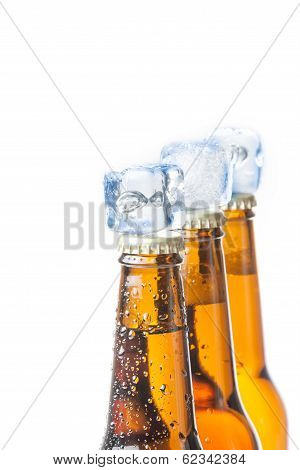 Three Bottle Of Fresh Beer With Ice On Top And Drops,concept Of Fresh Beer On Summer