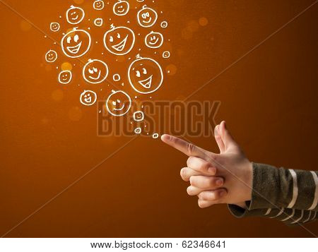 Group of happy hand drawed smiley faces coming out of gun shaped hands