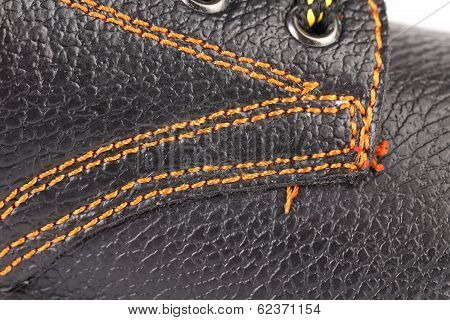 Shoe stiches on boot close up.