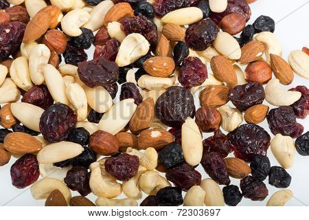 mixed nuts and dried fruits isolated on white background