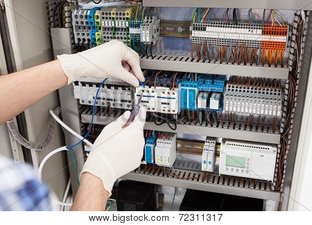 Technician Repairing Fusebox