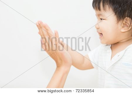 Isolate Cute Asian Baby Touch Hand With Mother