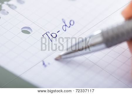 Hand With Pen And Paper