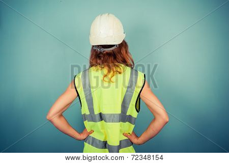 Young Female Engineer In High Vis And Hardhat