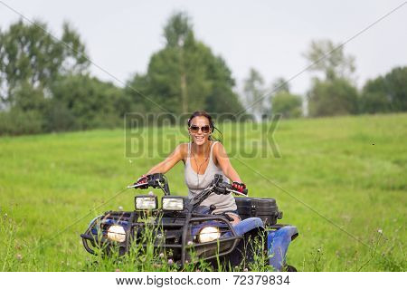 Elegant Woman Riding Extreme Quadrocycle