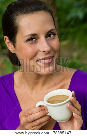 Beautiful Young Woman Drinking Coffee Outdoors
