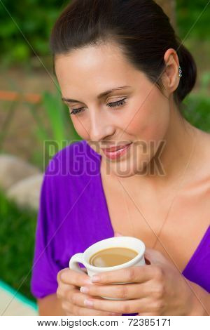Beautiful Young Woman Drinking Coffee Outdoors