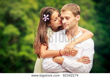 Brunette Bride Hugging Her Handsome Groom