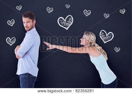 Desperate blonde reaching for boyfriend against blackboard