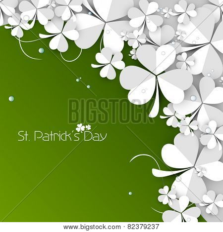 Beautiful white paper folded clover leaves on green background for Happy St. Patrick's Day celebration.