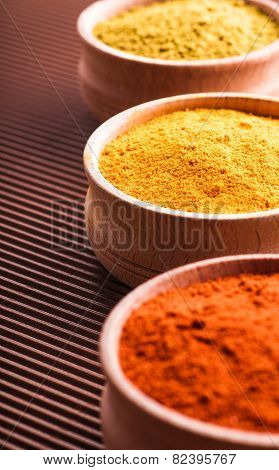 Spices Hops-suneli,turmeric,paprika In A Wooden Bowl Close-up