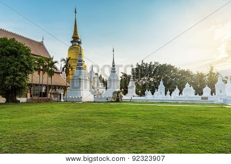 The Golden Pagoda At Wat Suan Dok, Chiangmai, Thailand, With Beautiful Blue Sky.