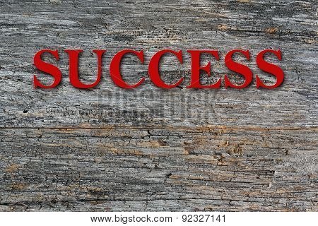 Success text on barn wood side