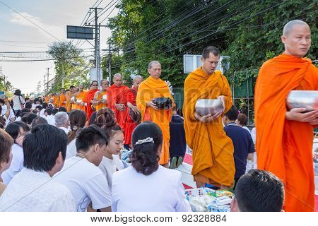 Many people give food and drink for alms to 1536 Buddhist monks in visakha bucha day