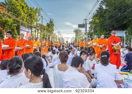 Many people give food and drink for alms to 1536 Buddhist monks in visakha bucha day