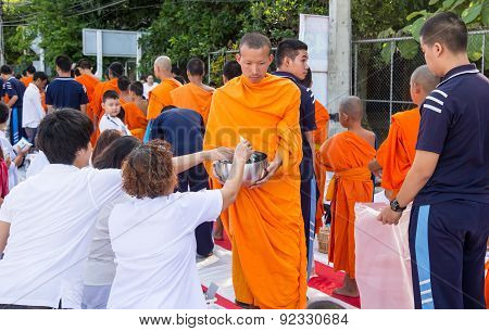 Many people give food and drink for alms to 1536 Buddhist monks in visakha bucha day