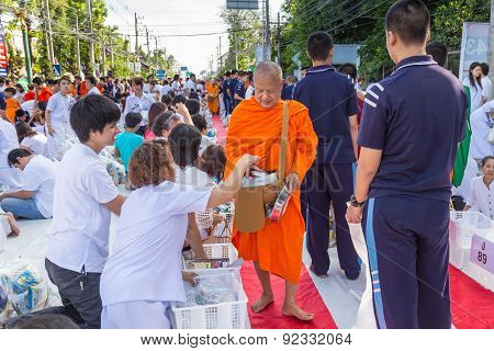 Many people give food and drink for alms to 1536 Buddhist monks in visakha bucha day
