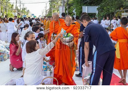Many people give food and drink for alms to 1536 Buddhist monks in visakha bucha day