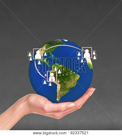 Planet earth in a human hand