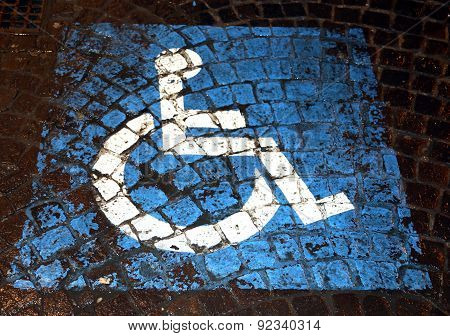 Symbol Of Handicapped Parking Painted On Porphyry In The Street