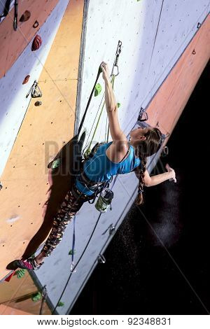 Female Sport Climber On The Climbing Wall