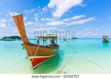 Wood Boat And Islands In Andaman Sea Against Blue Sky At Lipe