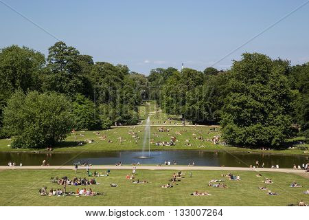 Frederiksberg, Denmark - June 5, 2016: People enjoying the sunshine in Frederiksberg park on a Sunday afternoon.