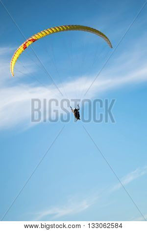Paraglider in the sky, paraglider on a blue background