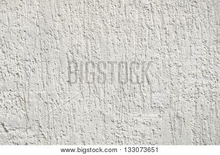 concrete wall background of a building with cracks not smooth