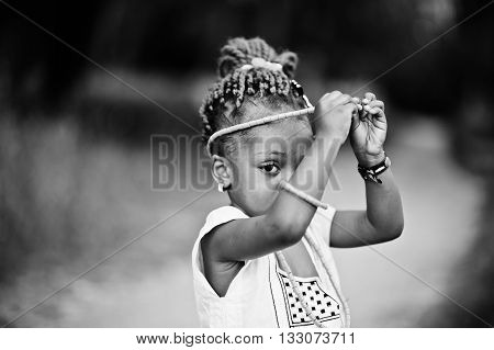 African baby girl walking at park outdoor