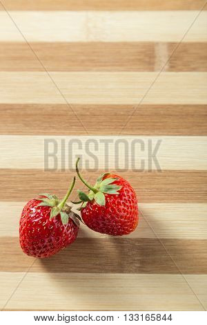 Fresh strawberry served on the wooden board