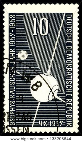 STAVROPOL RUSSIA - APRIL 30 2016: a stamp printed in GDR shows first Sputnik circa 1957
