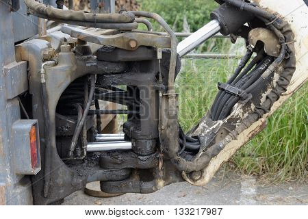 hydraulic connection of the bucket of the excavator close up