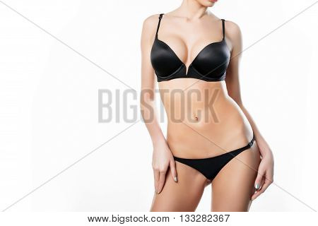 Beautiful slim body of woman in studio on the white background